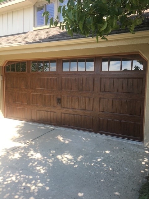Woodgrain carriage-house door with windows