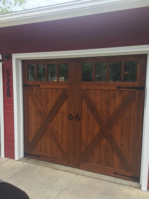 Cedar wood carriage door with X-brace and windows