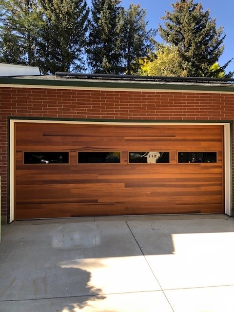 Cedar-look flush door with tinted glass windows