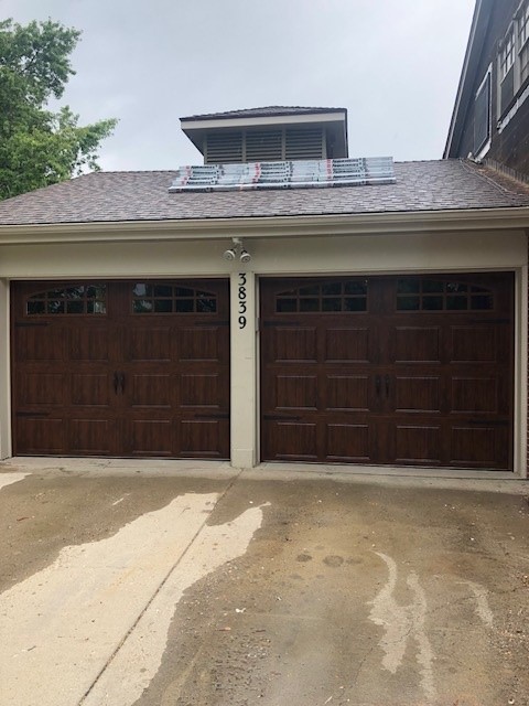 Dark woodgrain short-panel doors with arched windows